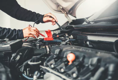 Technician Hands of car mechanic working in auto repair Service and Maintenance car battery