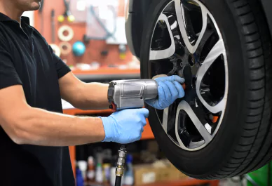 professional mechanic working on wheel alignment