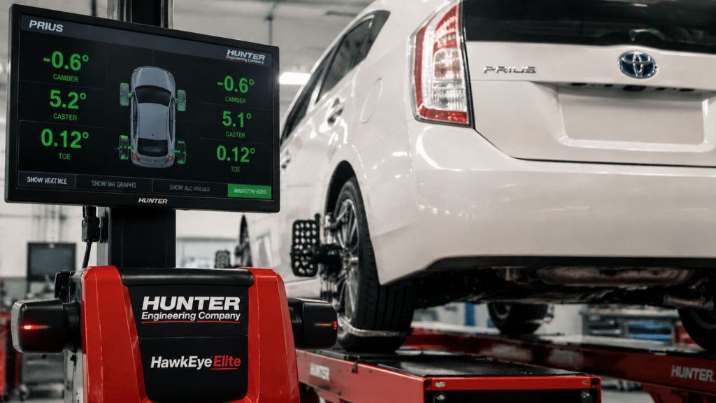 A professional precision wheel alignment on a Toyota hybrid vehicle using a Hunter Hawkeye Elite laser system at Simon's Automotive Service Center.